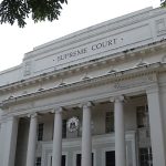 The photo shows the facade of the Supreme Court in Manila.